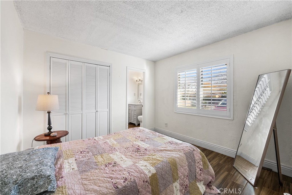 45323 Andale Avenue Lancaster, CA 93535 - Photo 17 of 29 a bedroom with a bed and a window