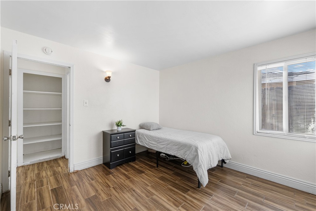 45323 Andale Avenue Lancaster, CA 93535 - Photo 21 of 29 a bedroom with a bed and a window