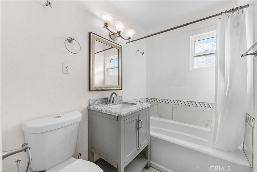 45323 Andale Avenue Lancaster, CA 93535 - Photo 22 of 29 a bathroom with a granite countertop sink toilet and shower