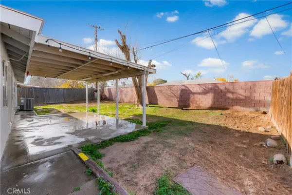 a view of a backyard with swimming pool
