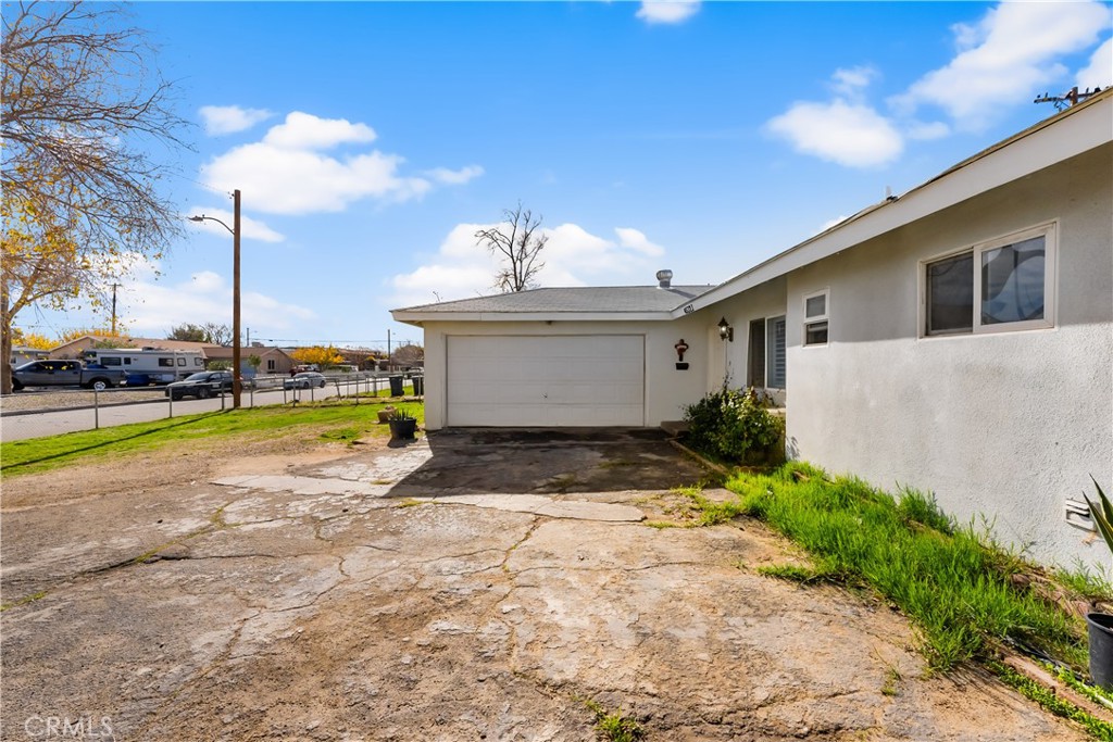45323 Andale Avenue Lancaster, CA 93535 - Photo 3 of 29 a view of a house with a backyard