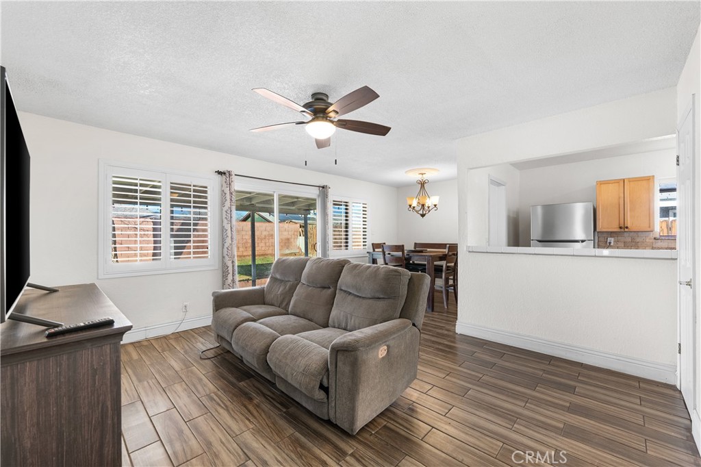 45323 Andale Avenue Lancaster, CA 93535 - Photo 5 of 29 a living room with furniture and a large window