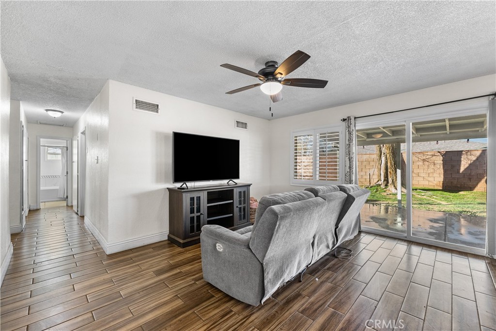 45323 Andale Avenue Lancaster, CA 93535 - Photo 6 of 29 a living room with furniture and a flat screen tv