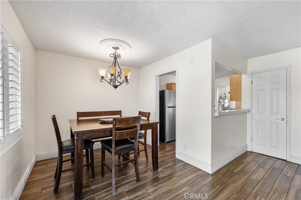 45323 Andale Avenue Lancaster, CA 93535 - Photo 9 of 29 a view of a dining room with furniture window and wooden floor