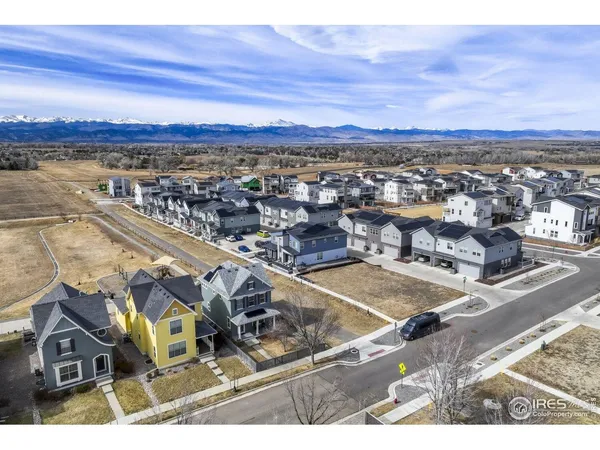 an aerial view of residential building and ocean