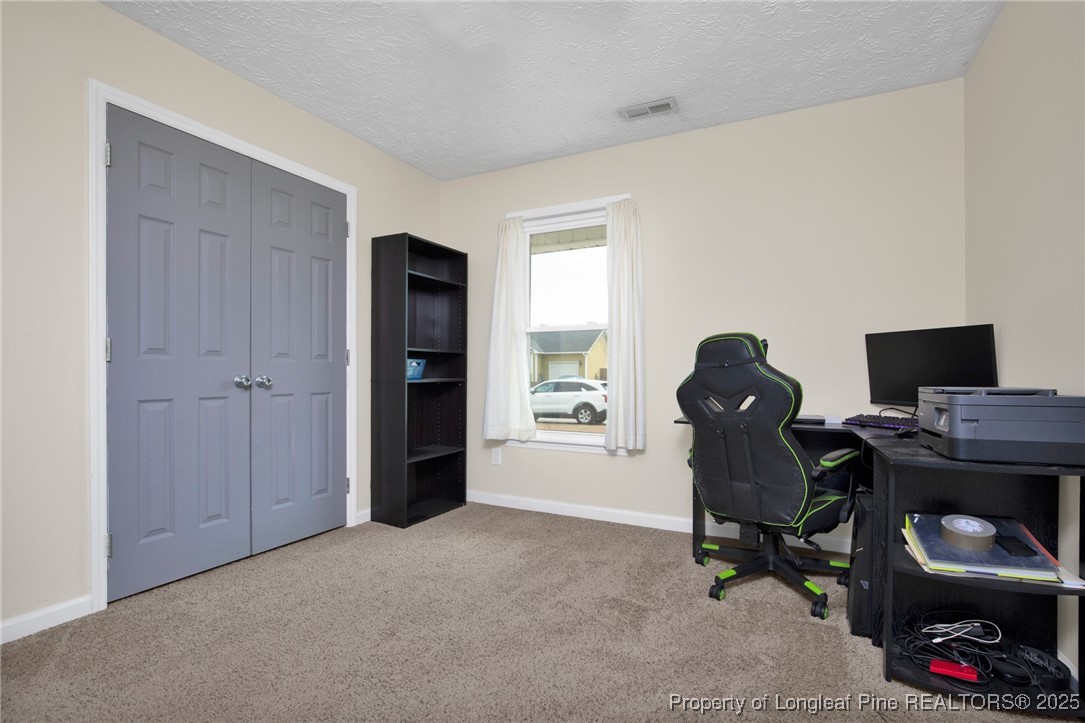 5004 Paulsun Drive Fayetteville, NC 28304 - Photo 18 of 31 a view of livingroom with workspace and a window