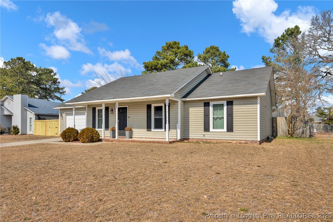 5004 Paulsun Drive Fayetteville, NC 28304 - Photo 3 of 31 a front view of a house with a garden
