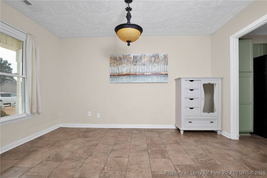 5004 Paulsun Drive Fayetteville, NC 28304 - Photo 7 of 31 a view of an empty room with a window