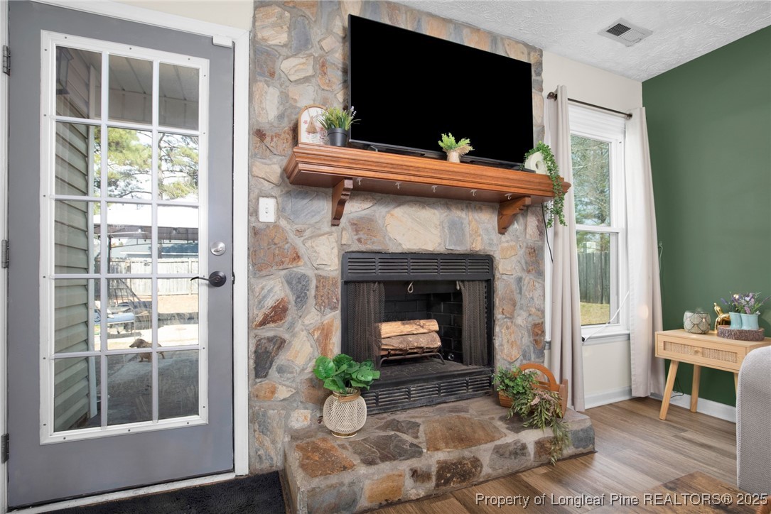 5004 Paulsun Drive Fayetteville, NC 28304 - Photo 10 of 31 a living room with furniture and a fireplace