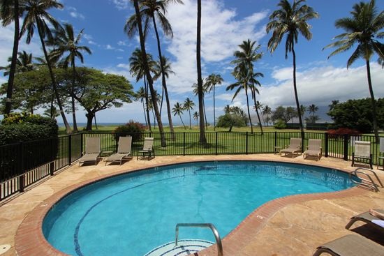 998 South Kihei Road, Unit 205 Kihei, HI 96753 - Photo 12 of 12 a view of a swimming pool with a table and chairs