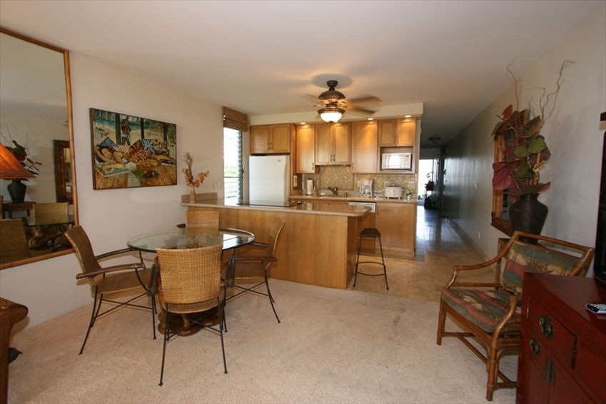 998 South Kihei Road, Unit 205 Kihei, HI 96753 - Photo 2 of 12 a view of a dining room with furniture