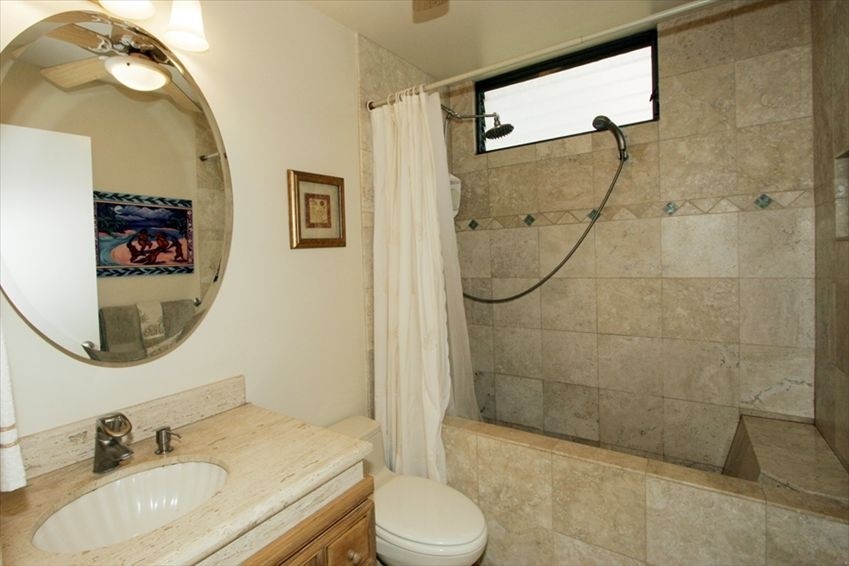 998 South Kihei Road, Unit 205 Kihei, HI 96753 - Photo 6 of 12 a bathroom with a sink toilet and shower