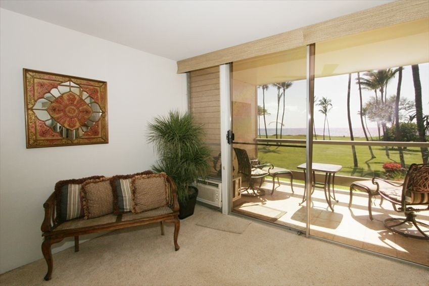 998 South Kihei Road, Unit 205 Kihei, HI 96753 - Photo 7 of 12 a living room with a large window and pool table