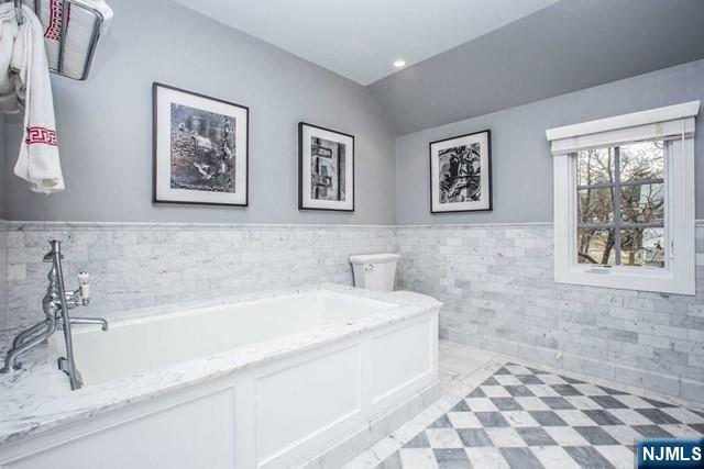 10 Orchard Place Tenafly, NJ 07670 - Photo 16 of 25 a bathroom with a bathtub and a shower