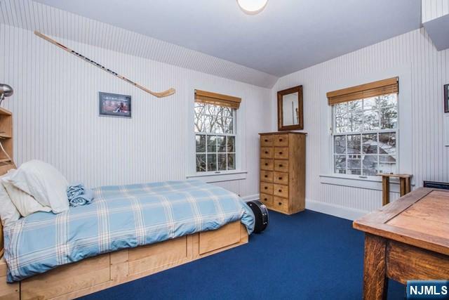 10 Orchard Place Tenafly, NJ 07670 - Photo 17 of 25 a bedroom with a bed and a table in it