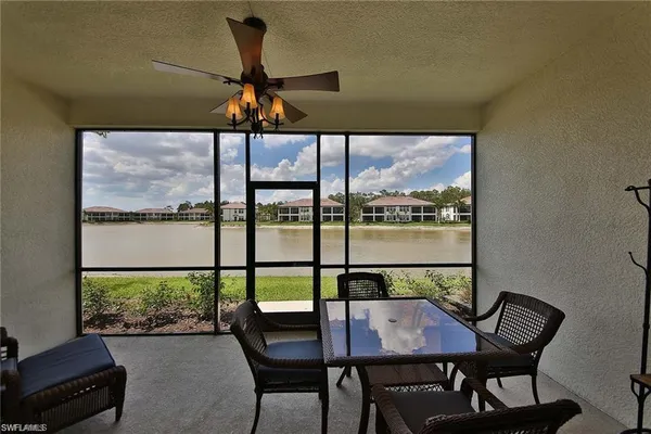 a view of a dining room with furniture window and outside view