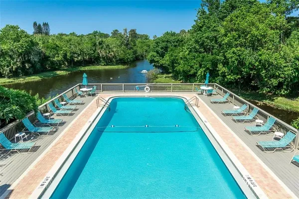 a view of a swimming pool with a lake view