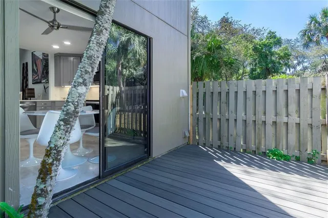 a couple of flower plants in front of building