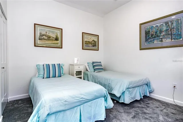 a bedroom with a bed and a table