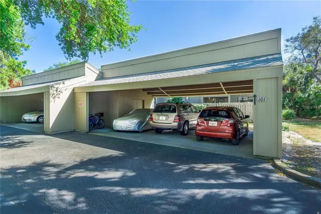 a view of swimming pool with a garden and plants