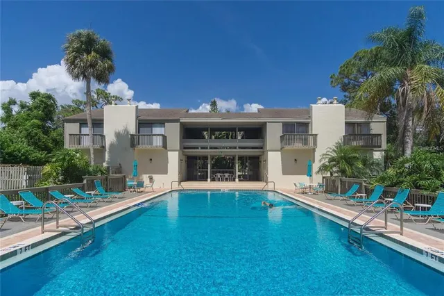 a view of a swimming pool with a lake view