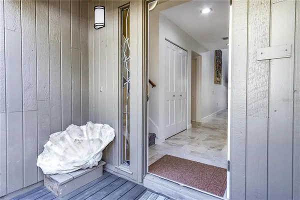 a living room with furniture a rug and a painting