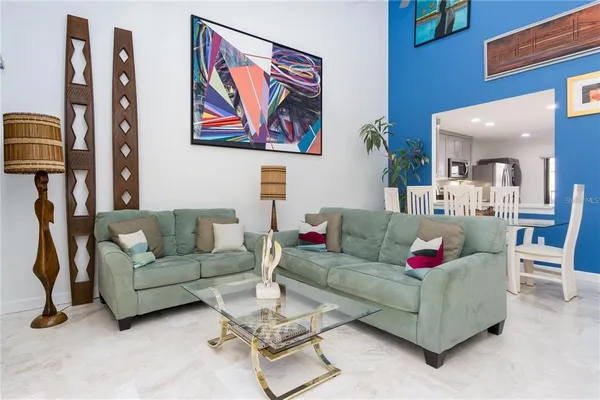 a living room with furniture and a large window