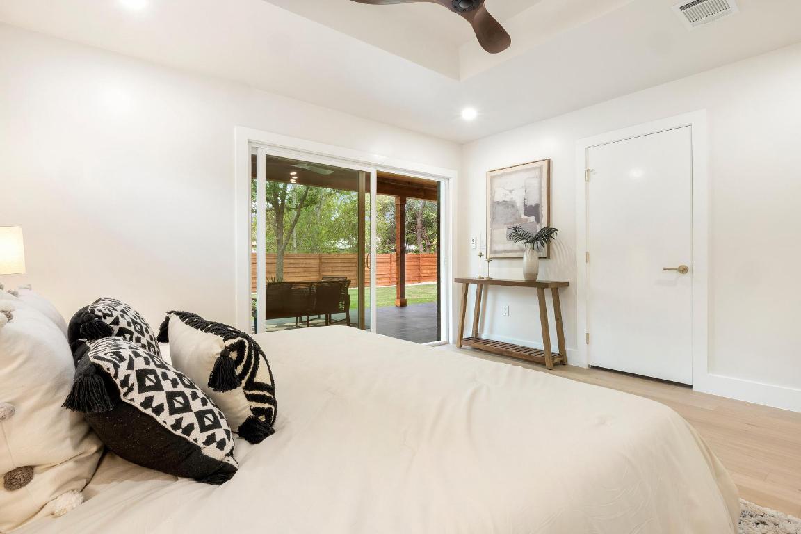 6404 Blarwood Drive Austin, TX 78745 - Photo 13 of 31 a bedroom with furniture and a large window