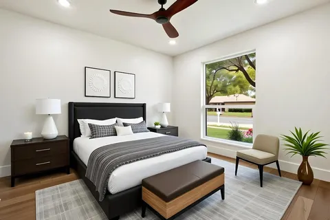 a bedroom with a bed and a window