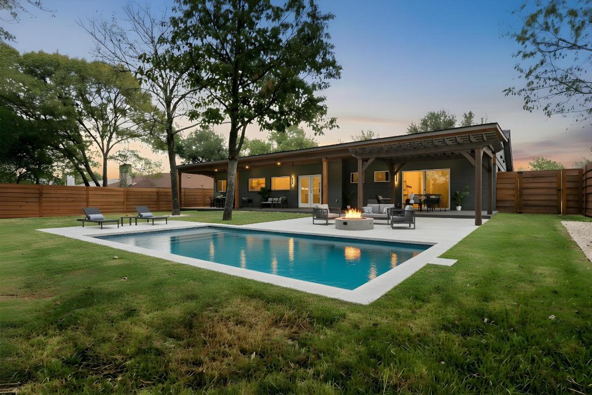 6404 Blarwood Drive Austin, TX 78745 - Photo 22 of 31 a view of a swimming pool with outdoor seating and a yard