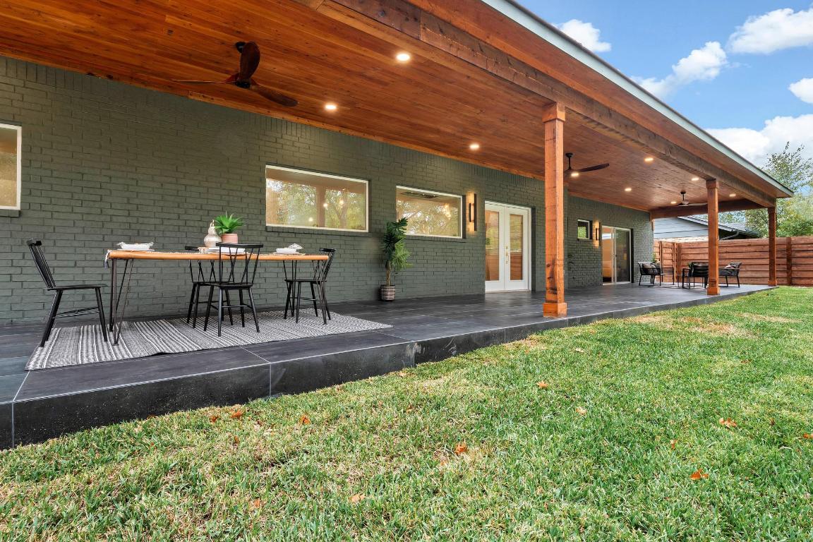 6404 Blarwood Drive Austin, TX 78745 - Photo 24 of 31 a view of a patio with table and chairs