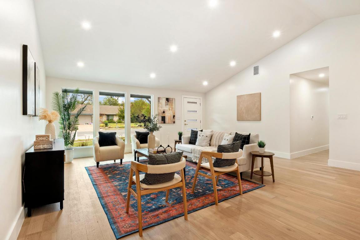 6404 Blarwood Drive Austin, TX 78745 - Photo 4 of 31 a living room with furniture potted plant and a large window