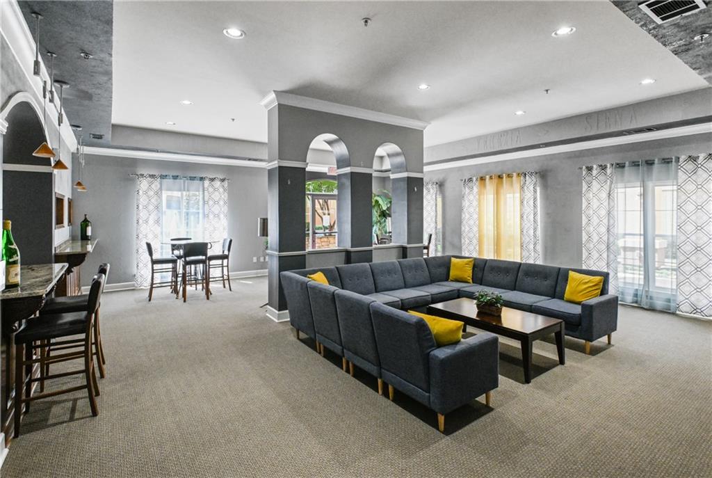 10 Perimeter Summit Boulevard, Unit 3311 Atlanta, GA 30319 - Photo 39 of 68 a living room with furniture and a large window