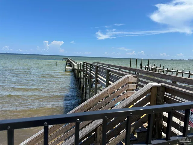 a view of swimming pool with outdoor seating