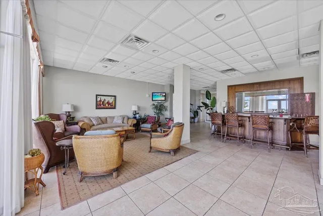 a living room with furniture a window and a table