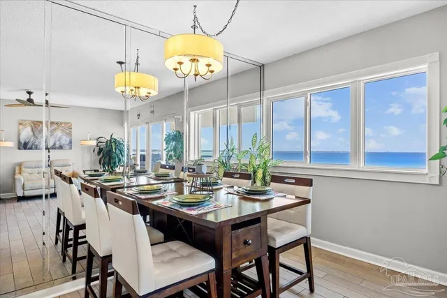 a view of a dining room that has a table and chairs