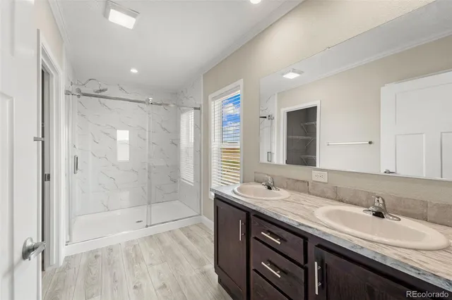 a bathroom with a granite countertop sink mirror and double