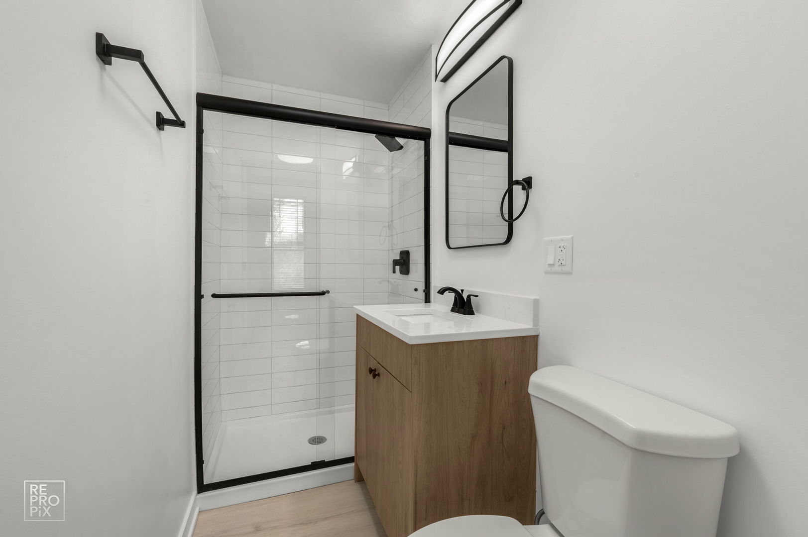 7717 North Sheridan Road, Unit 2F Chicago, IL 60626 - Photo 10 of 11 a bathroom with a sink a toilet and shower