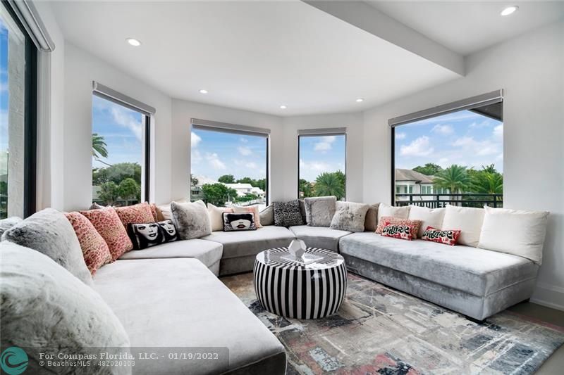 91 Compass Lane Fort Lauderdale, FL 33308 - Photo 19 of 59 a living room with furniture and a large window