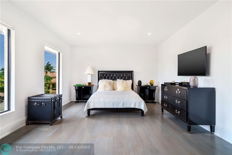 91 Compass Lane Fort Lauderdale, FL 33308 - Photo 20 of 59 a bed room with furniture and flat screen tv
