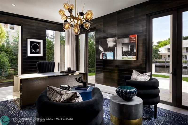 91 Compass Lane Fort Lauderdale, FL 33308 - Photo 39 of 59 a living room with furniture and a large window