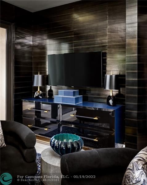 91 Compass Lane Fort Lauderdale, FL 33308 - Photo 40 of 59 a room with furniture and a fireplace