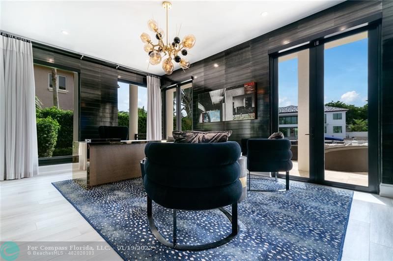 91 Compass Lane Fort Lauderdale, FL 33308 - Photo 5 of 59 a living room with furniture and a chandelier