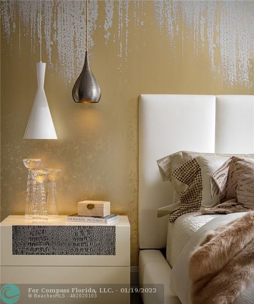 91 Compass Lane Fort Lauderdale, FL 33308 - Photo 56 of 59 a bedroom with a bed and a lamp