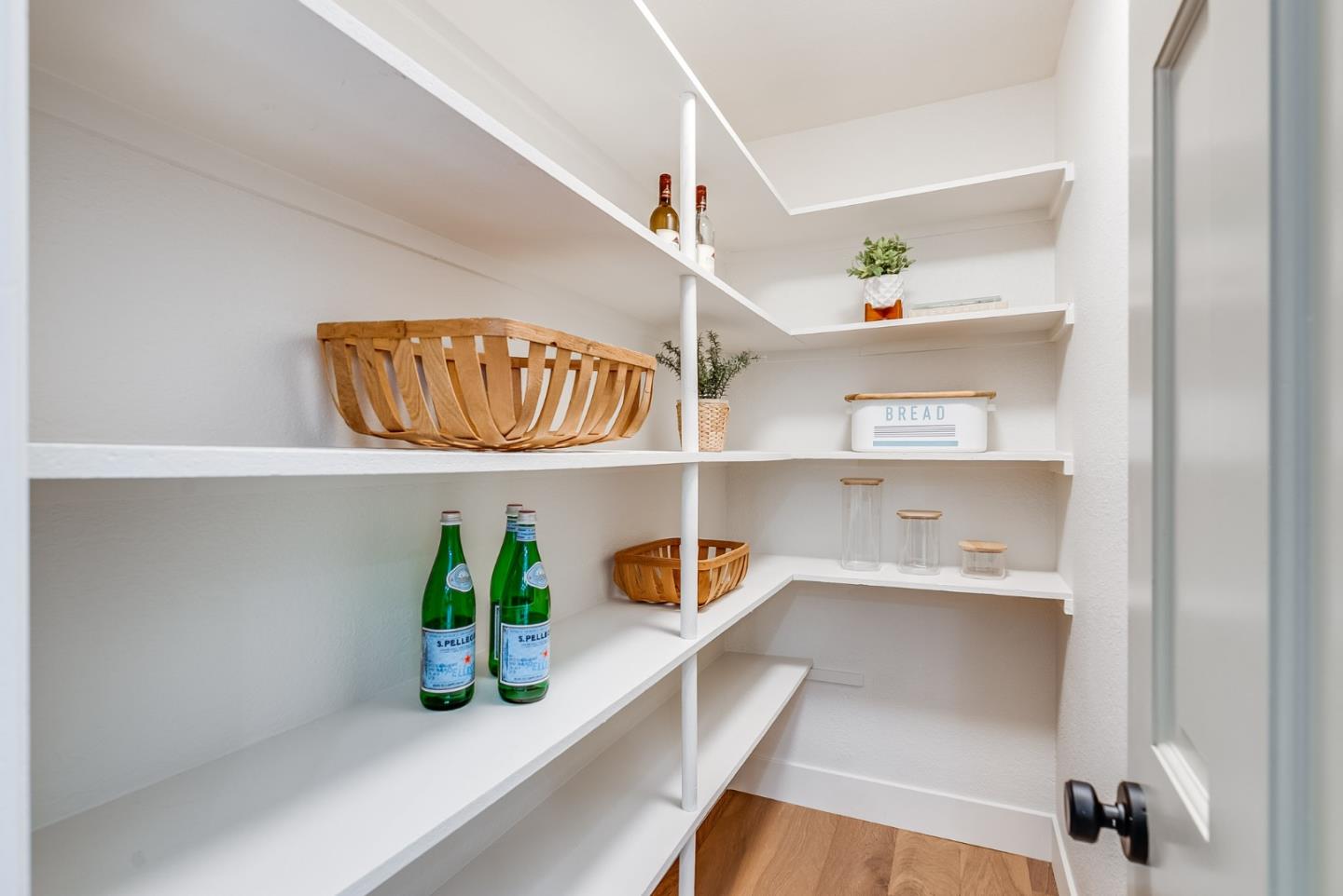 140 Echo Ridge Lane Soquel, CA 95073 - Photo 16 of 50 a kitchen with a faucet a potted plant on the wall and a window