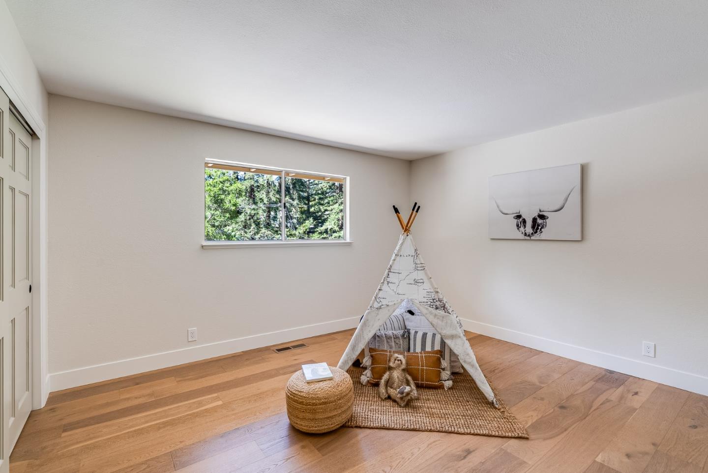140 Echo Ridge Lane Soquel, CA 95073 - Photo 23 of 50 a room with a table and white walls