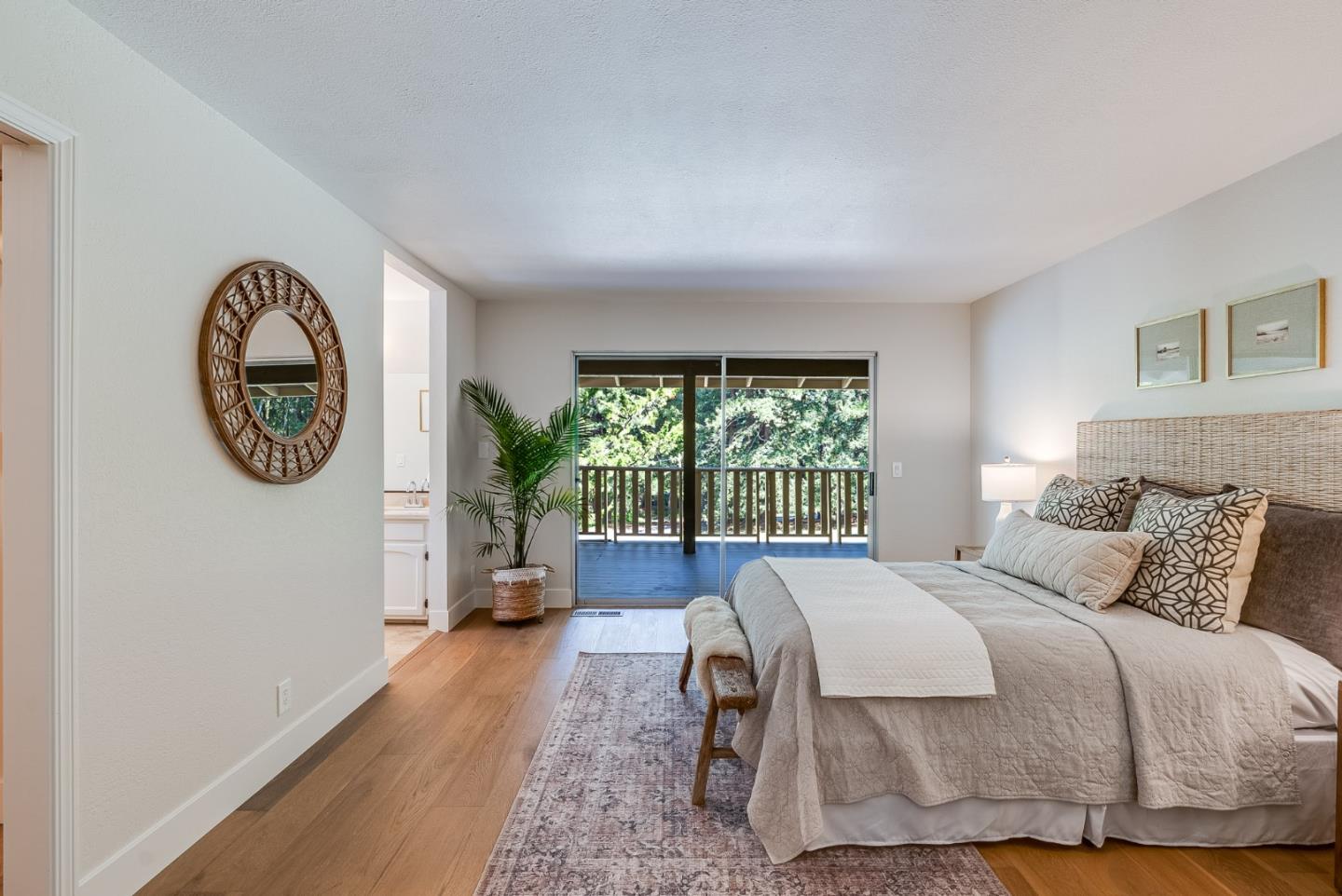 140 Echo Ridge Lane Soquel, CA 95073 - Photo 25 of 50 a bedroom with a bed a clock and a large window
