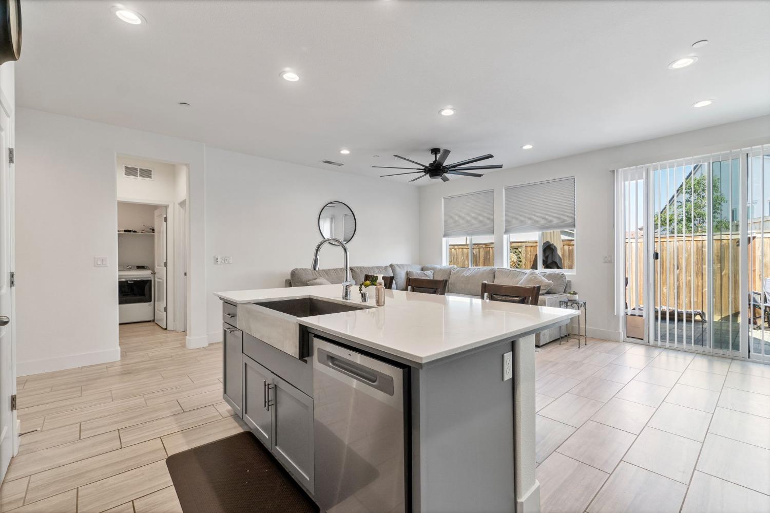 4218 Oak Knoll Road Madera, CA 93636 - Photo 11 of 37 a kitchen with a sink and cabinets