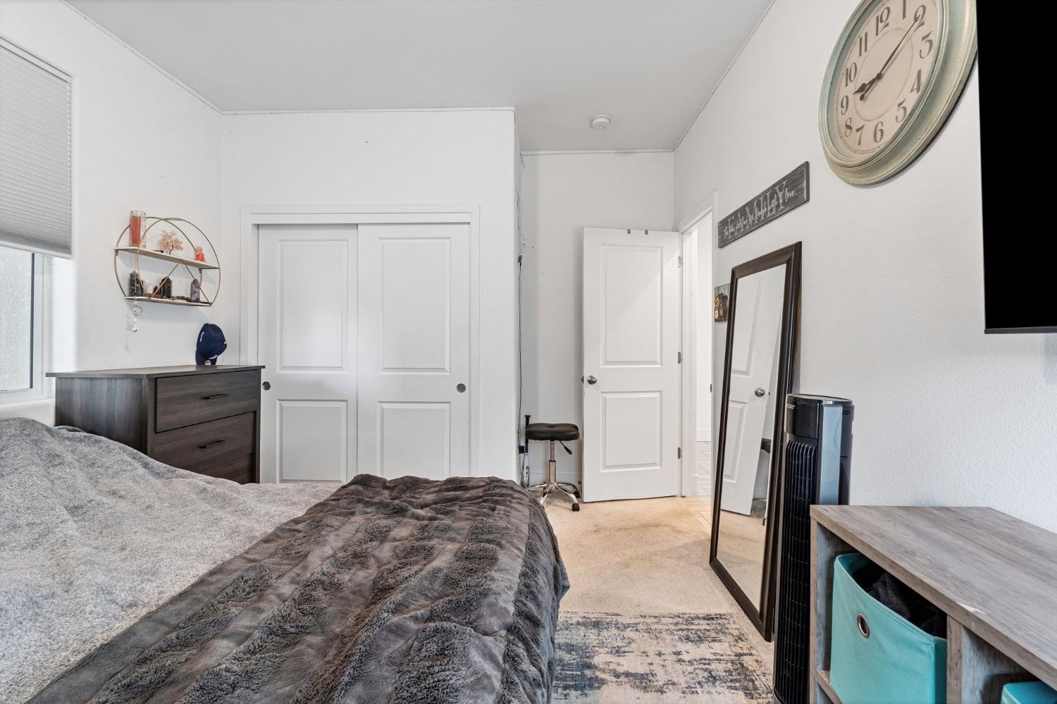 4218 Oak Knoll Road Madera, CA 93636 - Photo 14 of 37 a bedroom with a bed and a dresser in it