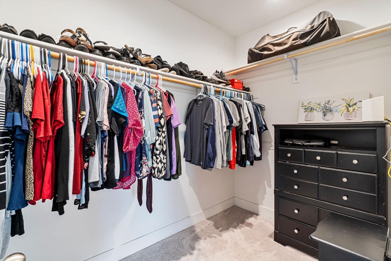 4218 Oak Knoll Road Madera, CA 93636 - Photo 18 of 37 a view of walk in closet with clothes